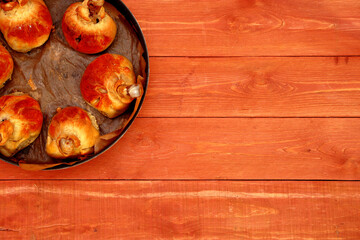 Meat on a leg.Chicken leg in batter in a frying pan. Chicken legs. for a festive table. Steak. On a wooden background. food. space for text.Still-life.	