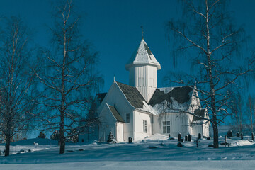 Fototapeta na wymiar Kolbu Church, Toten, Norway, in winter - version II