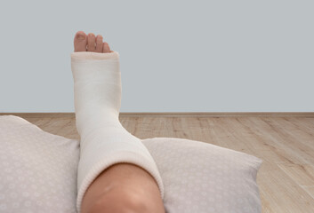 ankle and foot splint Bandages on the legs. Foot surgery, Wrapped feet with plaster or pressure...