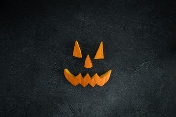 Halloween pumpkin pieces face cut out. Spooky laughing carved Jack Lantern eyes, nose and mouth....