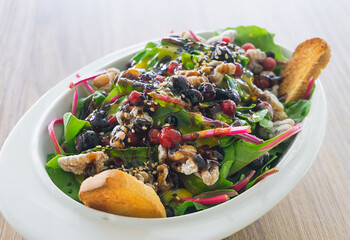 Fresh chard salad, caramelized walnuts, forest fruits. cherry tomato confit and honey