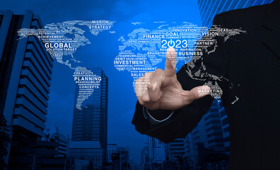 Businessman pressing 2023 start up business icon with global words world map over modern office city tower and skyscraper, Happy new year 2023 global business start up concept, Elements of this image 