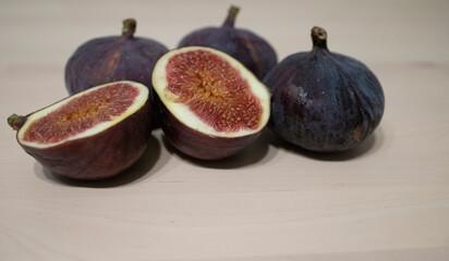 figs on a light table surface. Exotic fruits, vitamins, problems with the supply of fruit to Russia