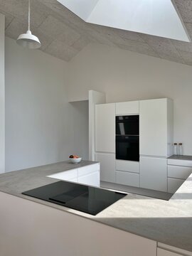 Contemporary white kitchen in a new build house, Denmark
