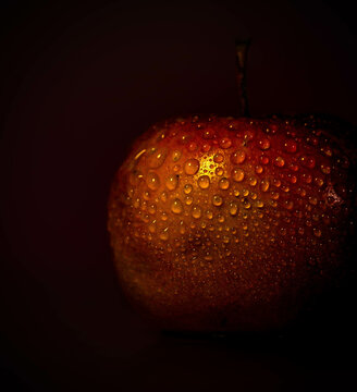 Arranged water drops on Red apple at black background free stock Image  
