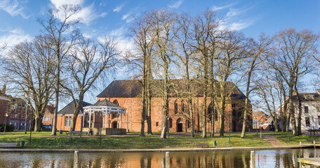 Fototapeta na wymiar Panorama of the historic Nicolai church at the harbor of Appingedam, Netherlands