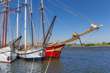 Historic tall ships on the IJssel river in Kampen, Netherlands - obrazy, fototapety, plakaty