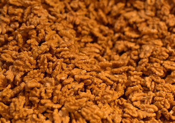 Background from walnuts. Peeled nuts.