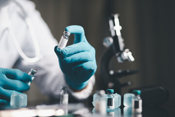 Concept Medical Laboratory Scientist Experimental Analysis of COVID-19 DNA Immunization Research Liquid for the Treatment of New Virus Disease