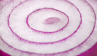 Fototapeta na wymiar Red onion, cut in half, inner part, close-up macro, selective focus, bokeh effect.