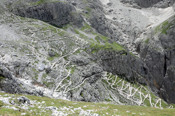 Impervious Zig Zag trail in the Dolomites Mountains on the Alps in summer in Italy