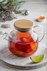 
fruit tea in a teapot on the table