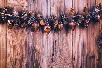 Christmas greeting card. Festive decoration on wooden background. New Year concept. Copy space.  Flat lay. Top view.