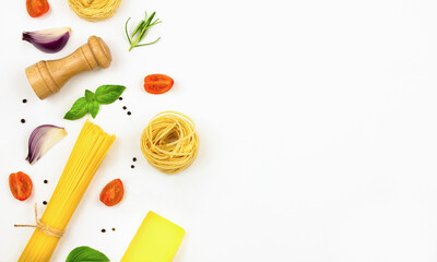 Ingredients for cooking pasta on a white background, copy space.