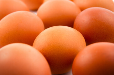 Fresh brown eggs close up. Food background.