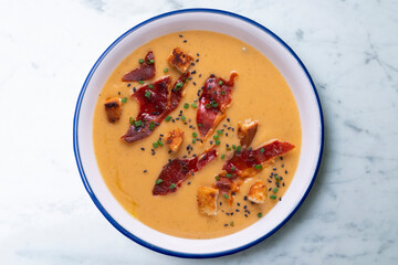 Tomato soup with crispy serrano ham.
