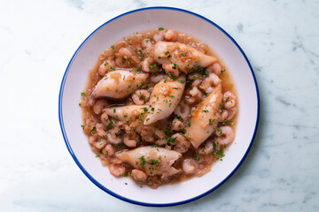 Squid with stewed prawns. Typical tapas of the Spanish coast.