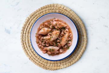 Squid with stewed prawns. Typical tapas of the Spanish coast.