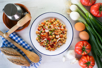 Chickpea salad with crab and vegetables. Cold salad typical Spanish cuisine.