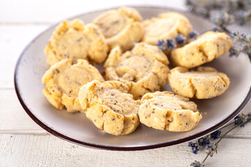 keto cookies on a white wooden background, decorated with lavender, close-up