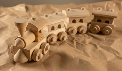 Children's wooden toy, train, on kraft paper