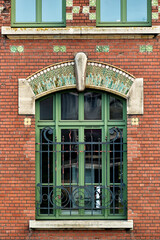 Obraz premium red brick and art deco tiled decoration on the facade of Lamartine middle school in Dunkirk, france