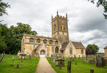 Fototapeta na wymiar 12th Century church of St Michael and All Angels, Withington, Gloucestershire, United Kingdom