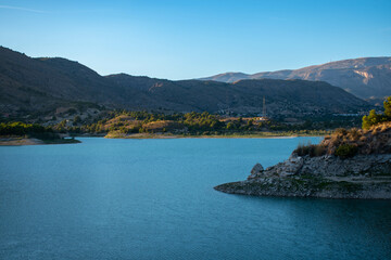 SUMMER SUNSET IN THE AMADORIO RIVER RESERVOIR