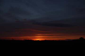 Beautiful sunset with orange and yellow clouds