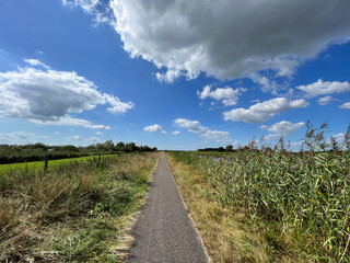 Fototapeta na wymiar Cycle path around Mildam in Friesland