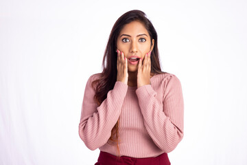Surprised young woman isolated on white.