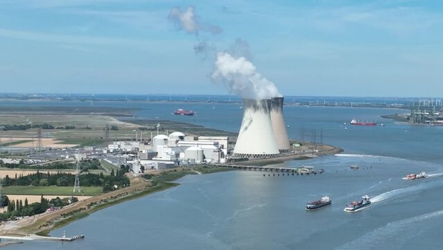 The Doel nuclear power plant, port of Antwerp. Belgium. Electric energy generation radioactive waste industrial reactor station facility. Aerial drone overview.Aerial drone panorama