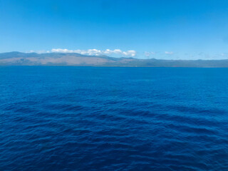 Fototapeta premium A merchant ship approaching Comores Island