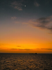 View from the bridge wings of a ship at sea in the evening