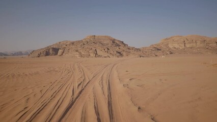 A journey in the planet Mars like landscape of Wadi Rum desert, a valley of red sand cut into the sandstone and granite rock in southern Jordan