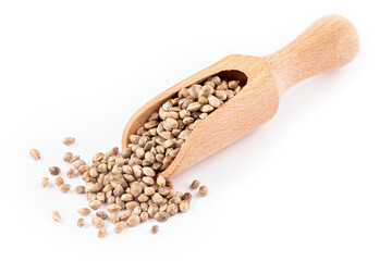 Wooden scoop with hemp seeds on white background.