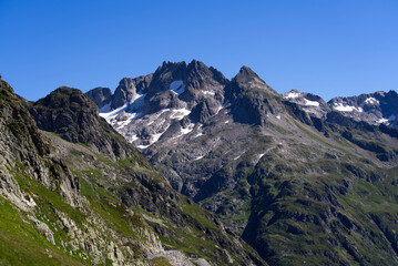 Fototapeta na wymiar Beautiful mountain panorama at Swiss mountain pass Sustenpass with Meien Valley on a sunny summer day. Photo taken July 13th, 2022, Susten Pass, Switzerland.