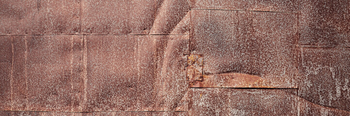 Old rusty metal texture. Rust on the surface of the iron wall. Panoramic background for grunge design.