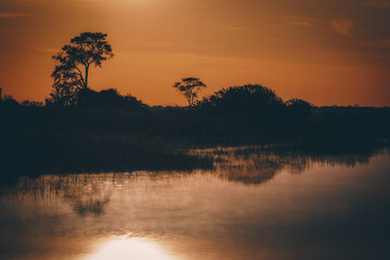 Sonnenuntergang auf dem Kwando Fluss, Caprivi, Namibia