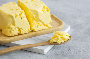 Turkish traditional homemade village butter in wooden spoon, healthy dairy product