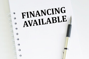 financing available text written on paper with pen