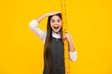 Teenager school girl study math or geometry lesson, measure the size. Mathematics ruler for...