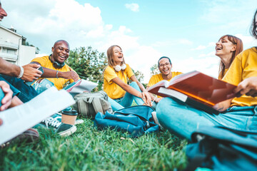 Group of university students standing together sitting in college campus - Happy multiracial friends hanging outside having fun at park - Young people community smiling together - Scholarship concept
