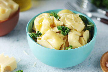 A bowl with Italian dumplings - tortellini