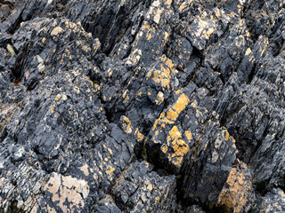 Beautiful rock deposits as a background. Stone layers close-up, full frame. Stone texture.