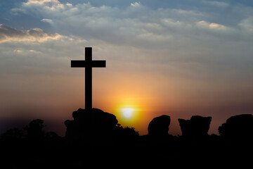 The cross of God in the rays of the sunset