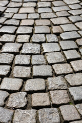 Cobblestone paving on old road background texture