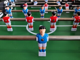 Arcade table soccer with tools for playing for office and home games.
