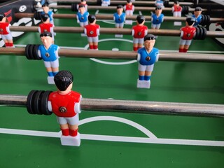 Arcade table soccer with tools for playing for office and home games.
