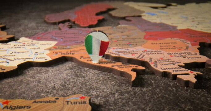 Italy - Travel concept pushpin on the world map. The location point on the map points to Rome the capital of the Italy.